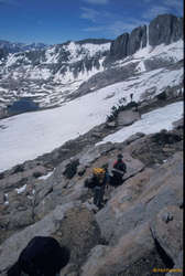 Rich and Karalee descending McCabe Pass, with North Peak and Steelhead Lake in the background