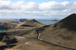 Looking south west from Eldfell,  Surtsey is the island at the far rear right