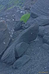 Black rocks, green moss, on top of Stóri-Meitill