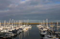Patches of sun out my window the marina that never changes