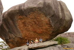 Matthew, Karl, Helen and Mum under a big rock
