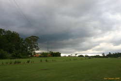 Farmhouse under grey skies
