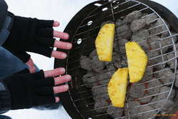 Grilling pineapple, warming hands
